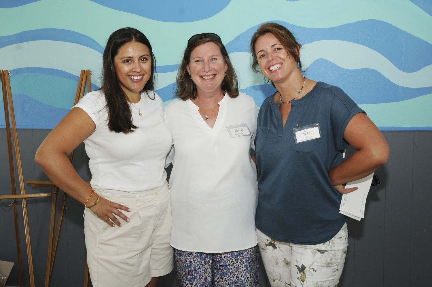 Brittany Ballington, Rebecca Morgan-Taylor and Sonja Becker at Project MOST's  Summer Picnic at The Neighborhood House on Three Mile Harbor Road in East Hampton On Sunday afternoon. The benefit, hosted by Lenny Ackerman and Patti Silver, gave guests the opportunity to learn about Project MOST's future home.    RICHARD LEWIN