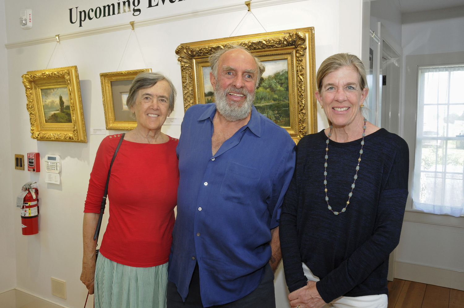 Marie-Therese and Neil Hausig with Carolyn Logan Gluck at the opening reception for Alfred Ross's photography exhibit 