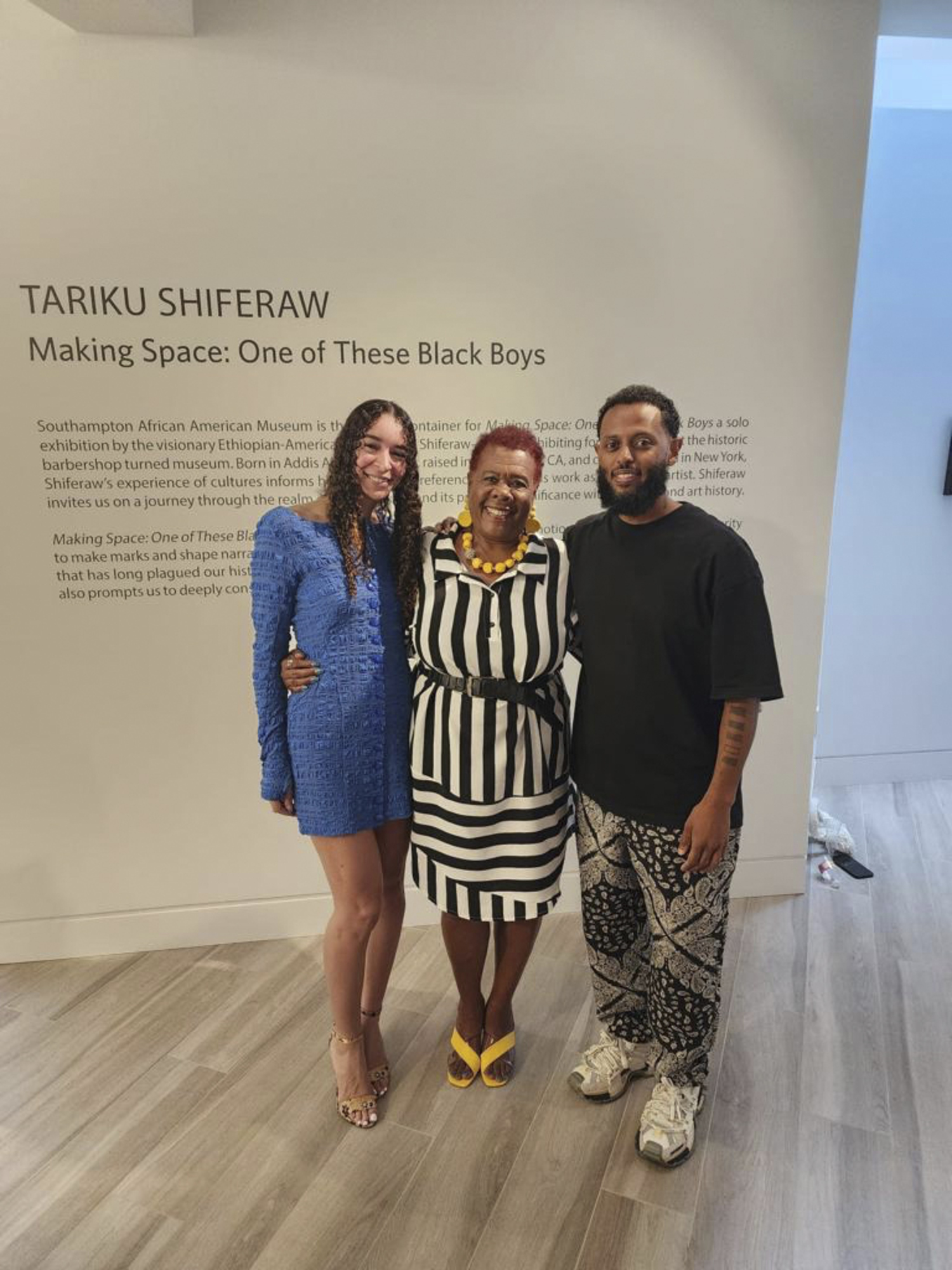 Curator Storm Ascher, Executive Director Brenda Simmons and Artist Tariku Shiferaw at the opening of the exhibition, “ Making Space: One of These Black Boys,” at the Southampton African American Museum (SAAM0 on August 4.   COURTESY SAAM