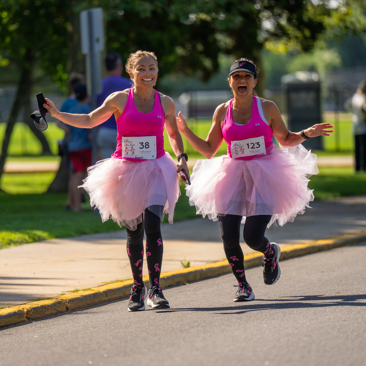 Raquel Styler, left, and JoAnn Bennett head toward the finish line together.   RON ESPOSITO