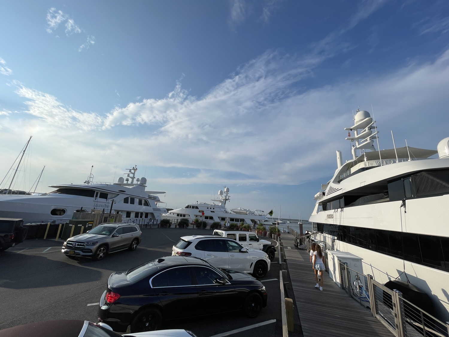 High demand for slips in Sag Harbor have resulted in large yachts being tied up perpendicularly across Long Wharf on several occasions this summer. MICHAEL WRIGHT