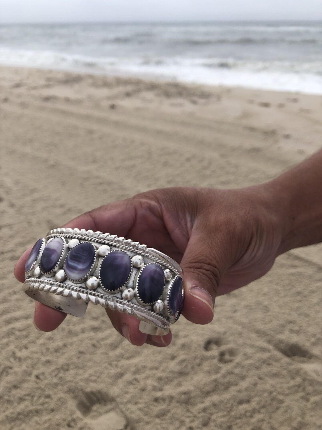 Gordell Wright displays his wampum jewelry. He will have a booth at the Shinnecock Powwow over Labor Day weekend. CAILIN RILEY