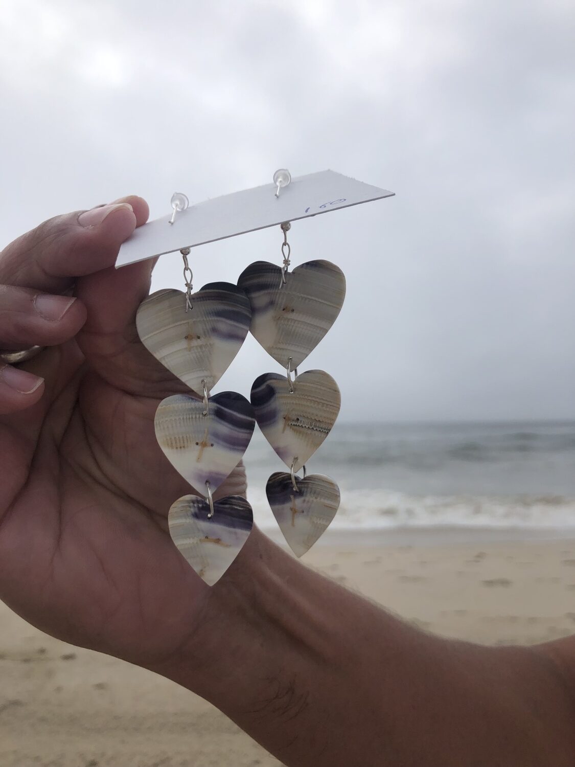 Gordell Wright displays his wampum jewelry. He will have a booth at the Shinnecock Powwow over Labor Day weekend. CAILIN RILEY