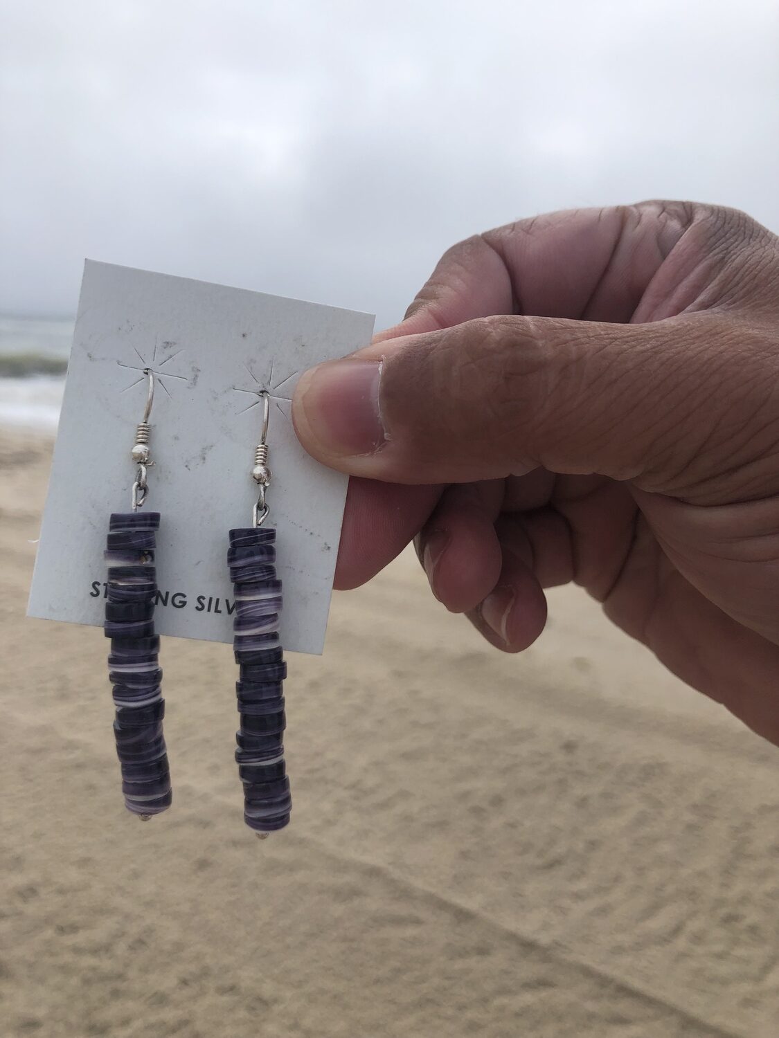 Gordell Wright displays his wampum jewelry. He will have a booth at the Shinnecock Powwow over Labor Day weekend. CAILIN RILEY