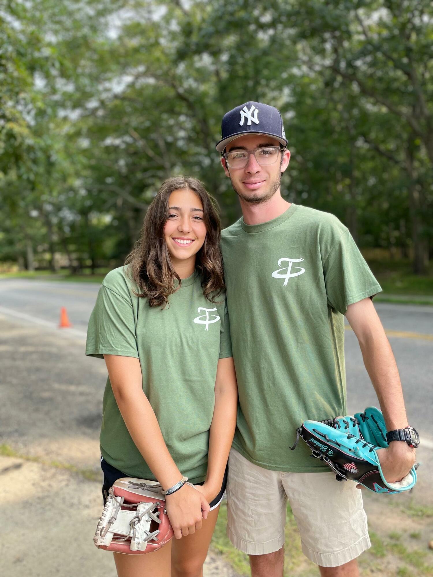 Two of the eight scholarship recipients, Emma Terry and Hunter Eberhart, who threw out the first pitches on opening day of the tournament on Thursday, August 3.