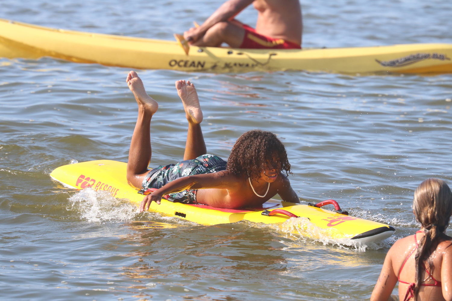 Junior lifeguards competing in the paddleboard relay.  CINTIA PARSONS