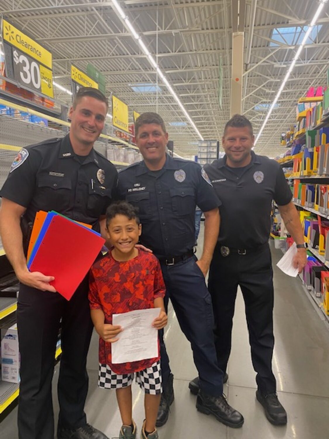 Officers shopping with kids at Walmart during the annual 