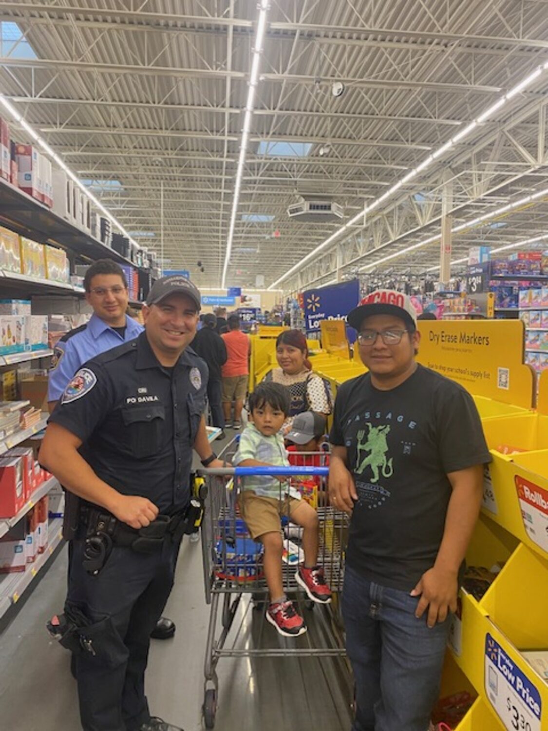 Officers shopping with kids at Walmart during the annual 