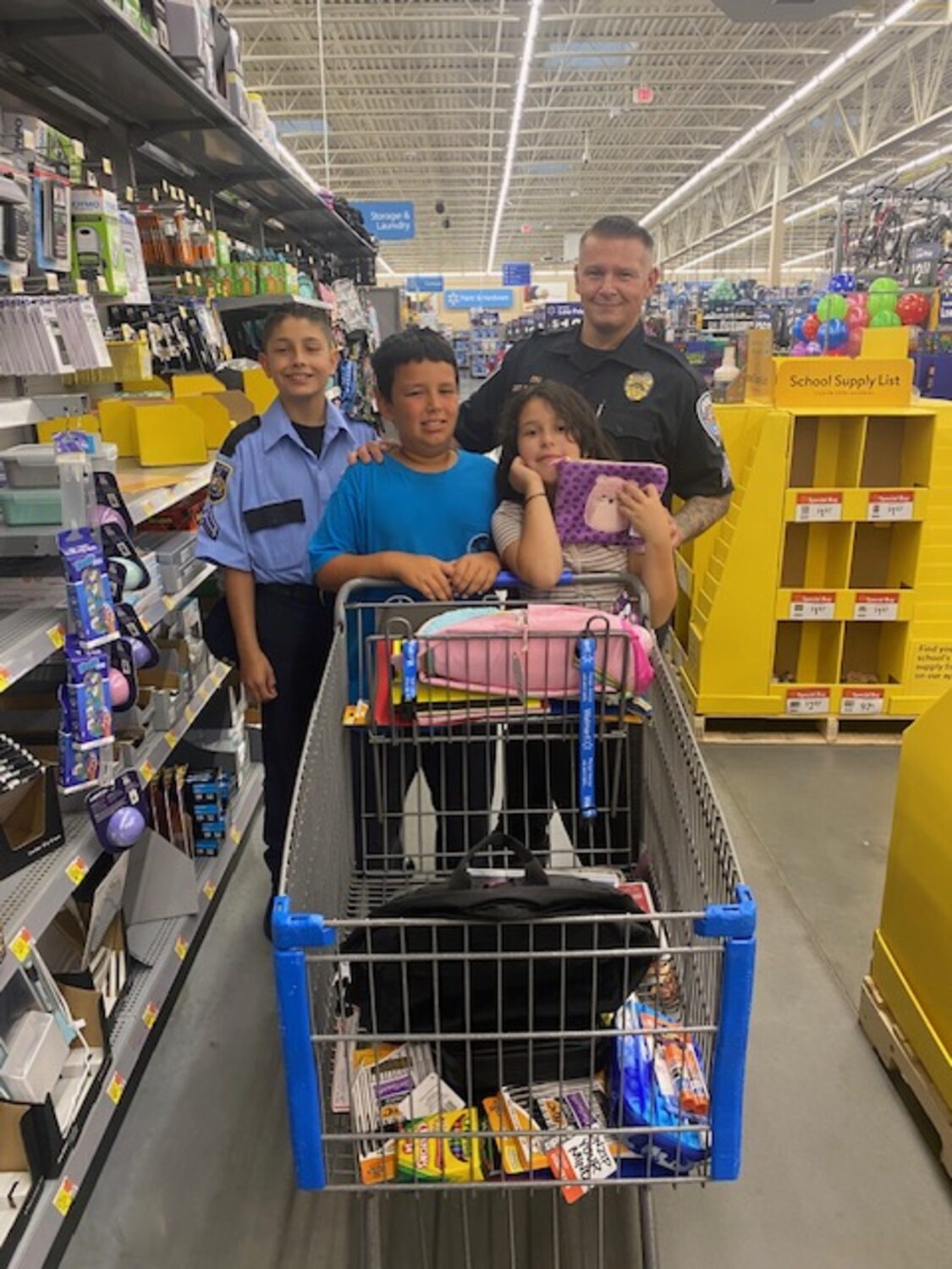 Officers shopping with kids at Walmart during the annual 