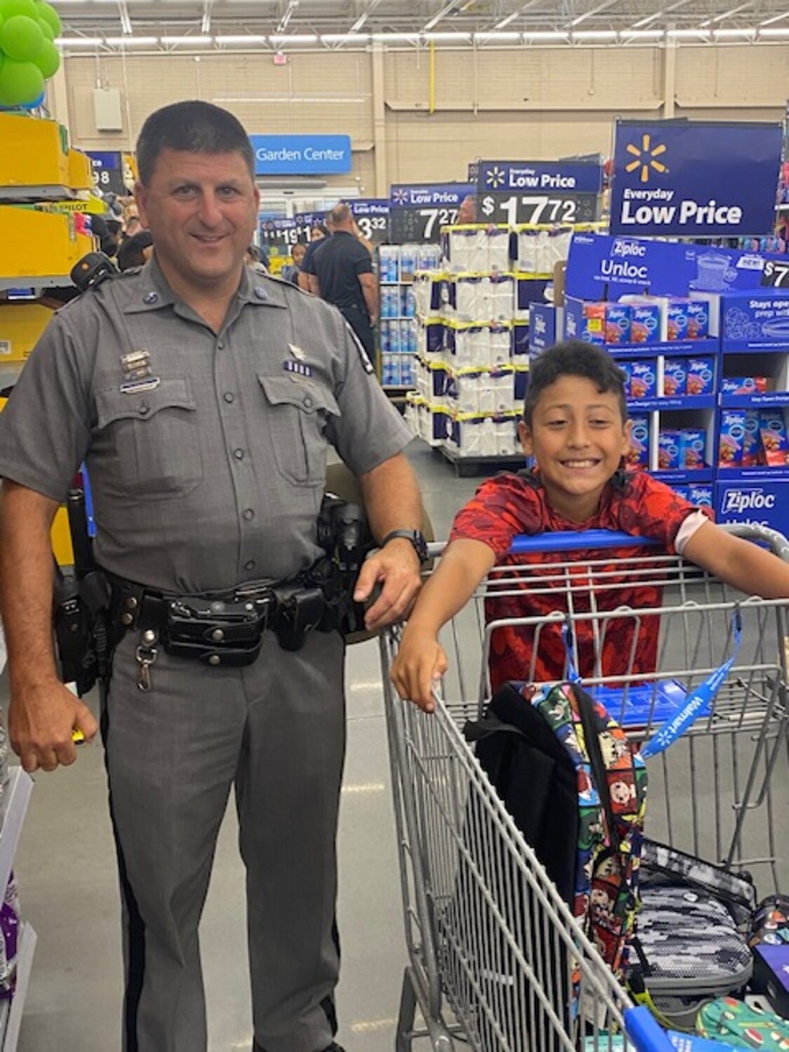 Officers shopping with kids at Walmart during the annual 