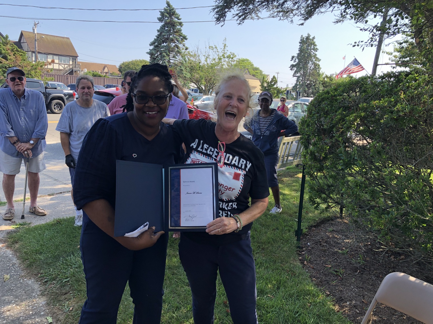 Jeanne Stevens was presented with a special service award by the Montauk postmaster, Jodi Douglas, at an event celebrating Stevens's retirement after 30 years at the Montauk post office counter last week. T.E. MCMORROW