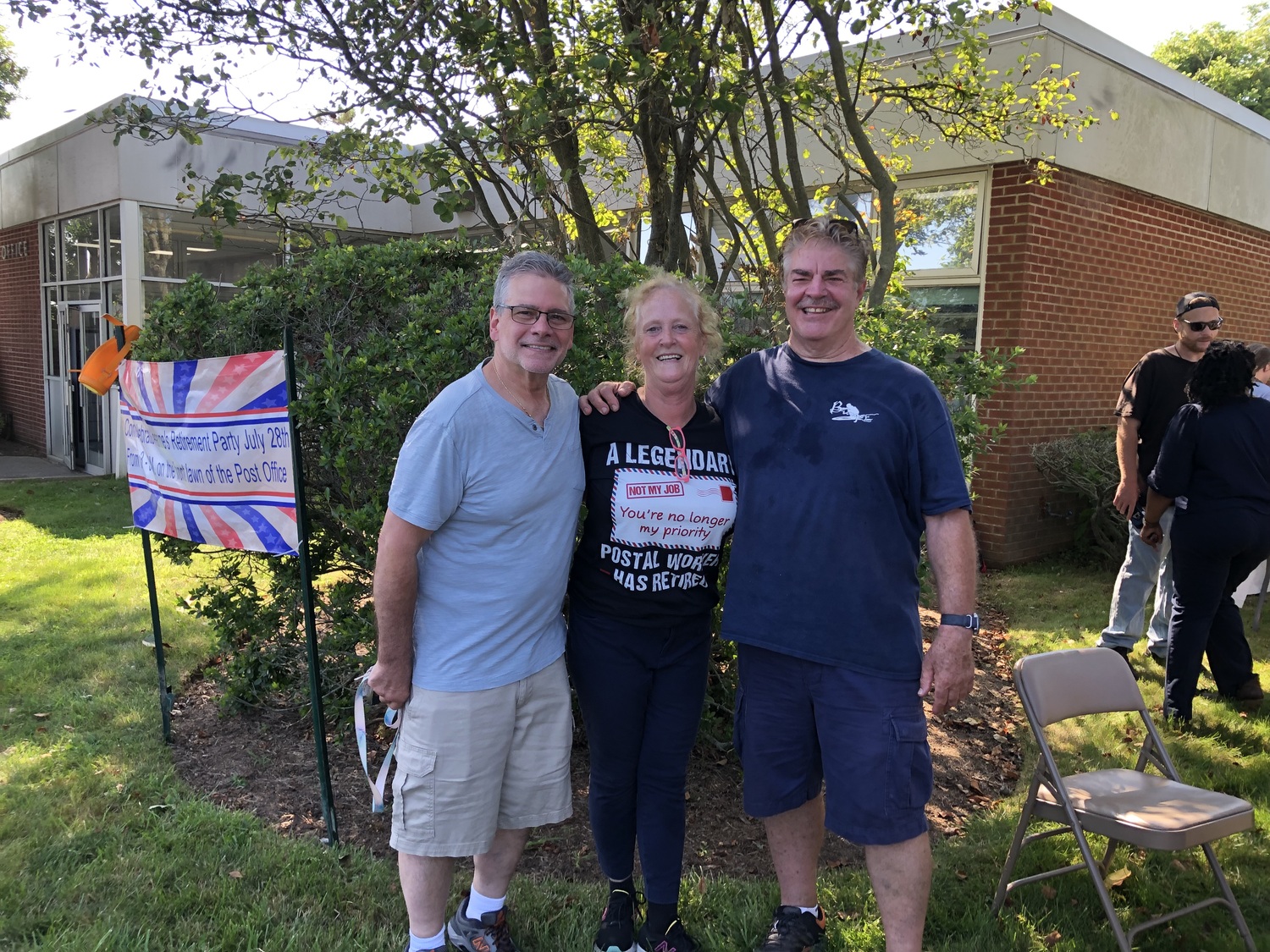 Jeanne Stevens was joined outside the Montauk post office last Friday during an event celebrating her retirement by two other former fixtures at the Montauk counter, Frank Carella, left, and Bruce Howard. T.E. MCMORROW