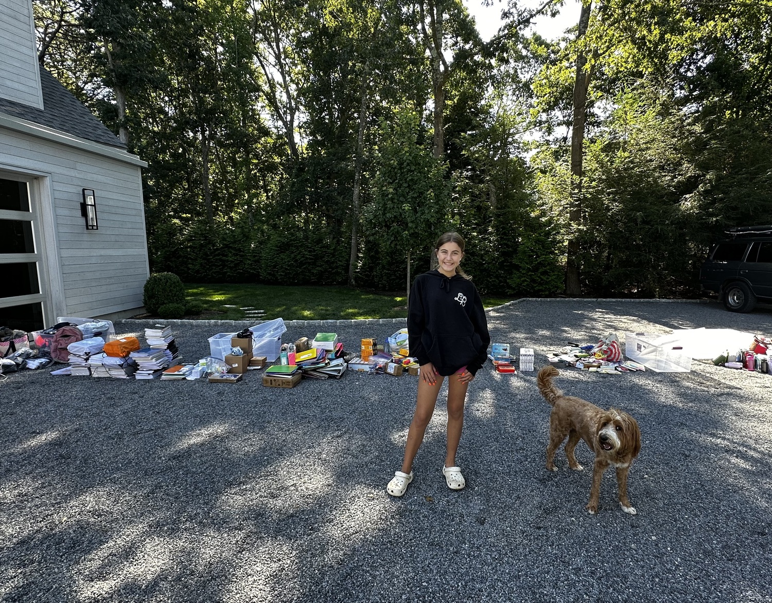 Westhampton Beach eighth-grader Leah Ravin organizing her back-to-school donations for Heart of the Hampton's Backpack Kids program. KARYN RAVIN