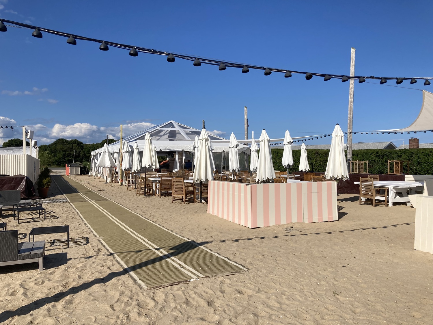 After a fire destroyed the former Rick's Crabby Cowboy Cafe the night before it was to open for the summer of 2023 as Maison Close, the owners of the chic French Riviera themed restaurant has been operating out of a tent on the property. 
KYRIL BROMLEY