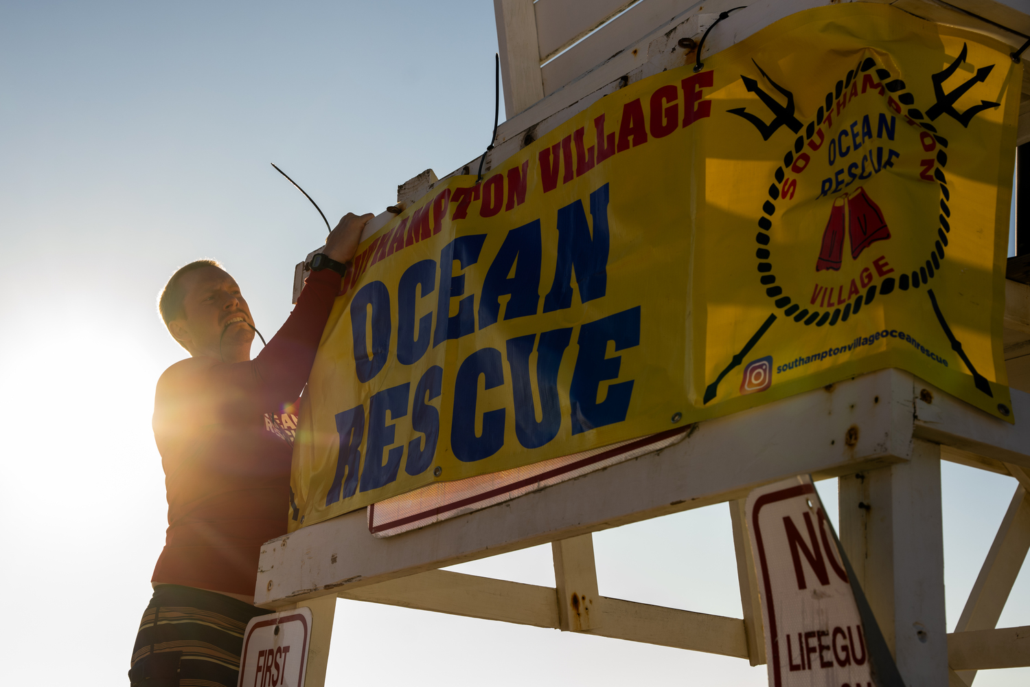 Dylan Henderson of SVOR puts up banners.   RON ESPOSITO