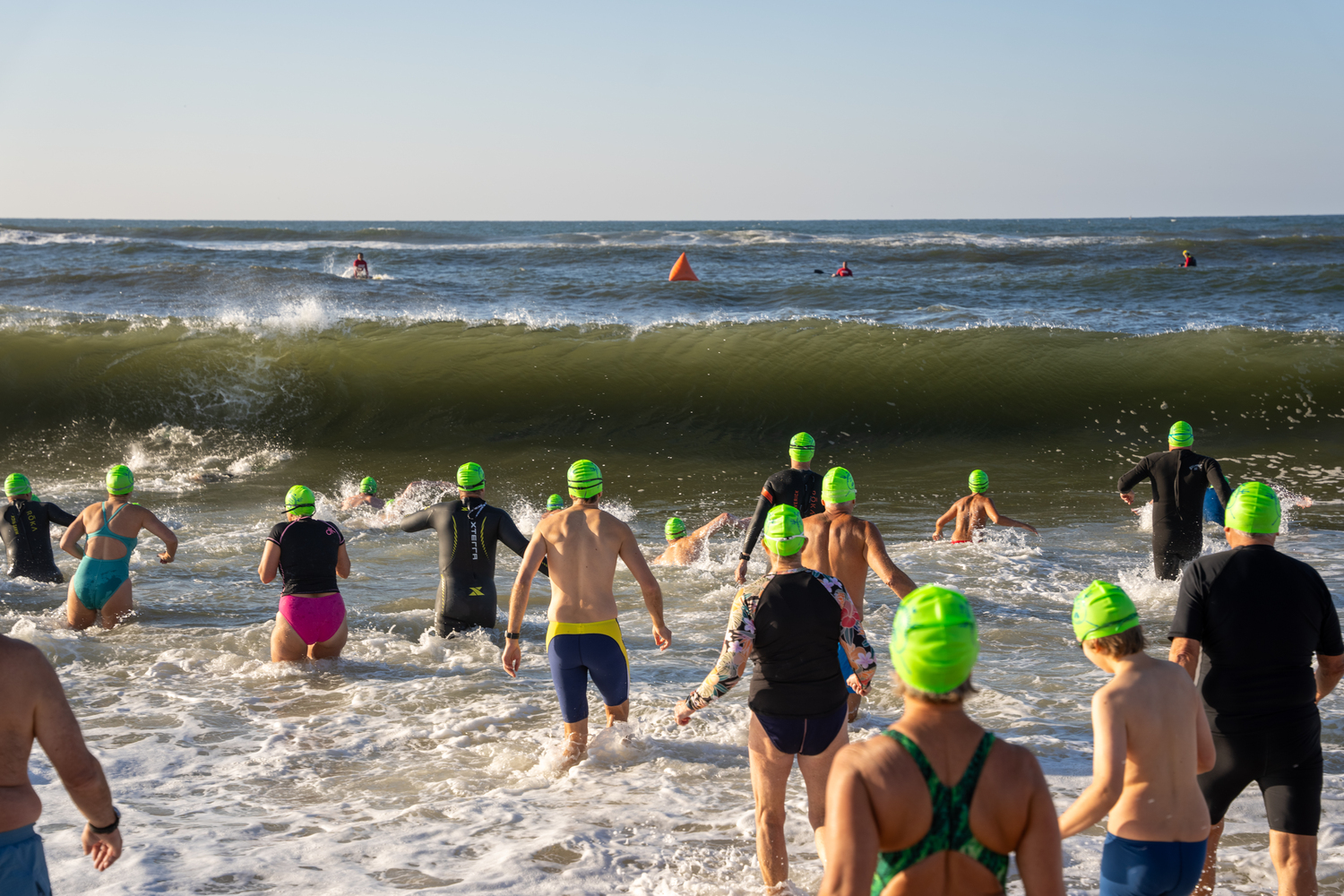 Swimmers jump right into the surf at Coopers Beach.  RON ESPOSITO