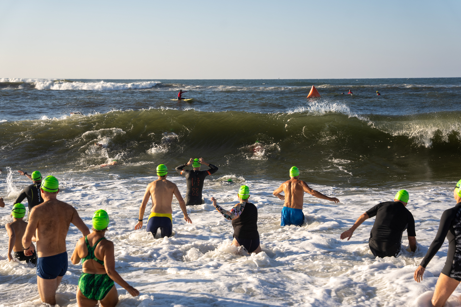 Swimmers jump right into the surf at Coopers Beach.  RON ESPOSITO