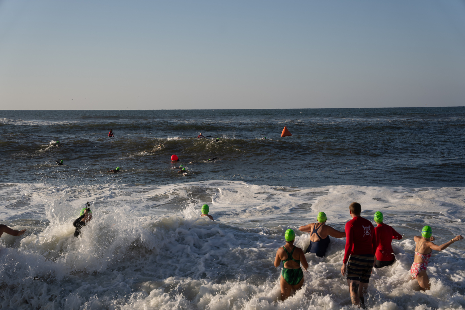 Swimmers jump right into the surf at Coopers Beach.  RON ESPOSITO