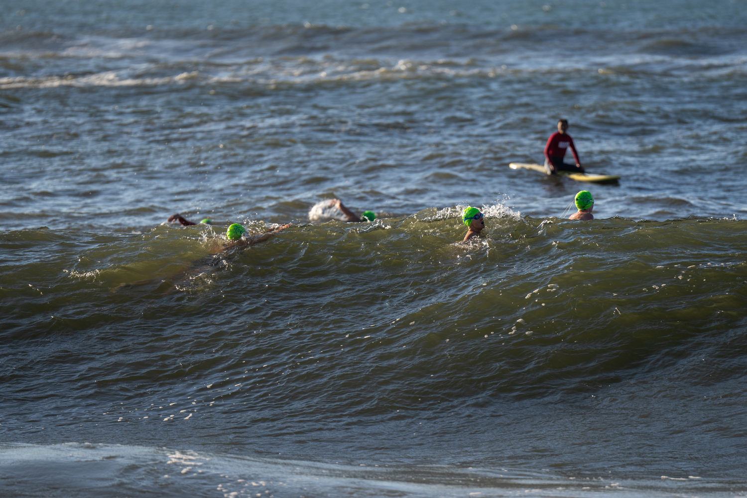 Swimmers jump right into the surf at Coopers Beach.  RON ESPOSITO