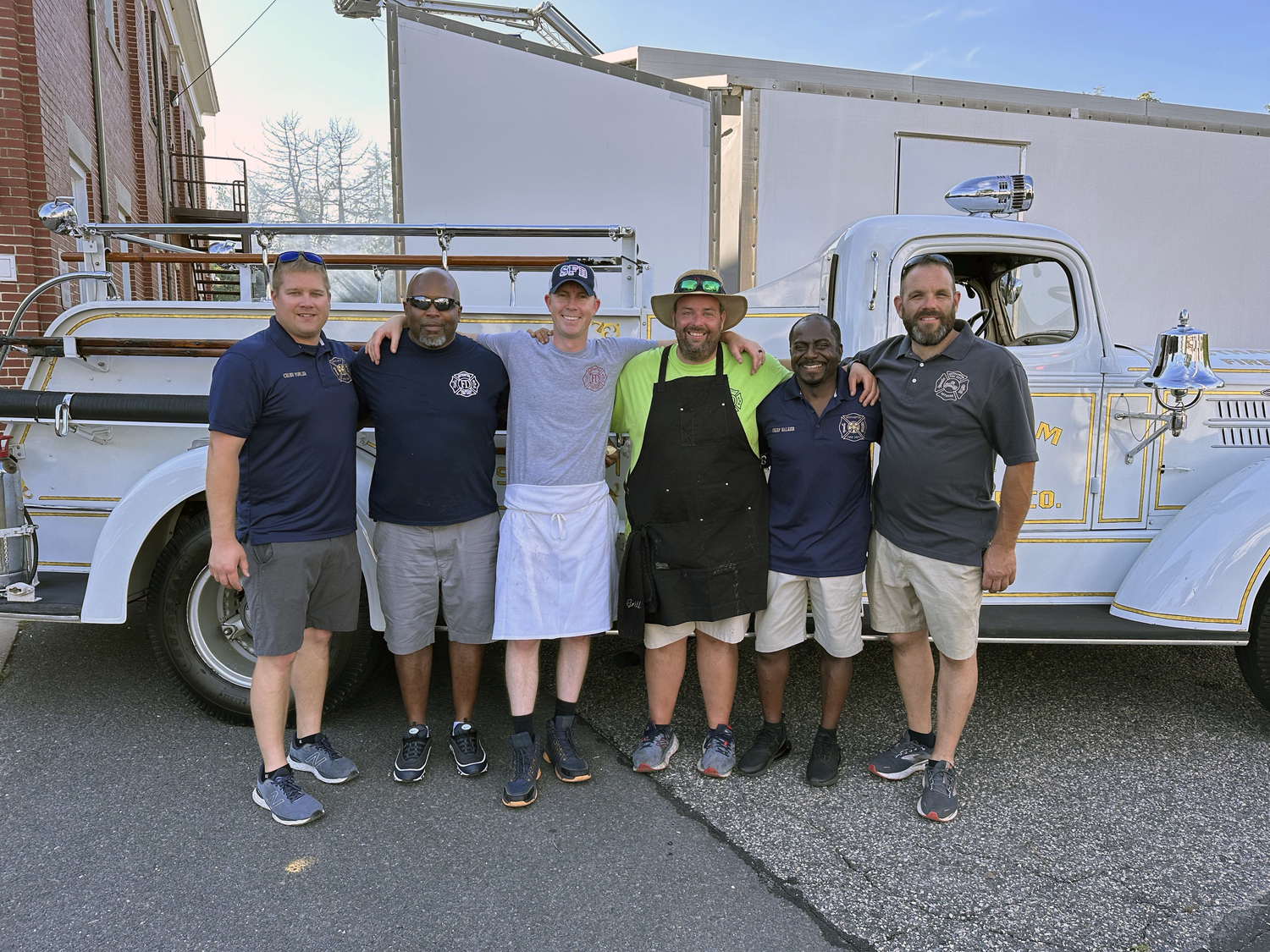 Chief Richard Fowler, Eddie West, Jeremy McMahon, Matt Shimkus, Chief Polis Walker and Eric Halsey at the Southampton Fire Department's chicken and rib dinner.  GREG D'ELIA