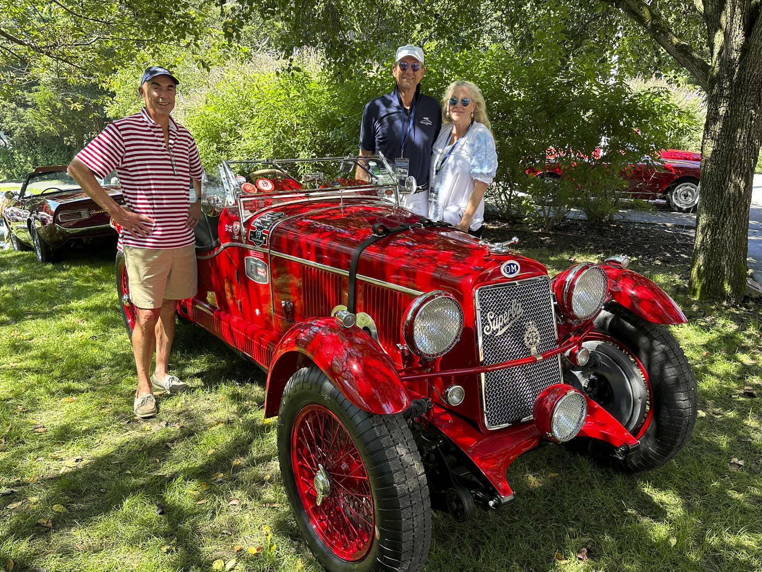 Malcolm Price with Rome and Lisa Arnold at the Concours d'Elegance.   GREGD'ELIA