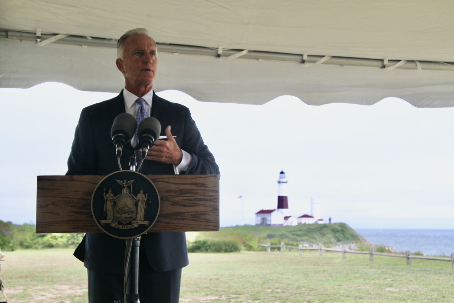 Montauk Lighthouse Keeper Joe Gavioloa speaking to local and state officials at the dedication of the new revetment, built by New York State and the US Army Corps of Engineers, to protect the bluff the lighthouse sits atop. 
MICHAEL WRIGHT