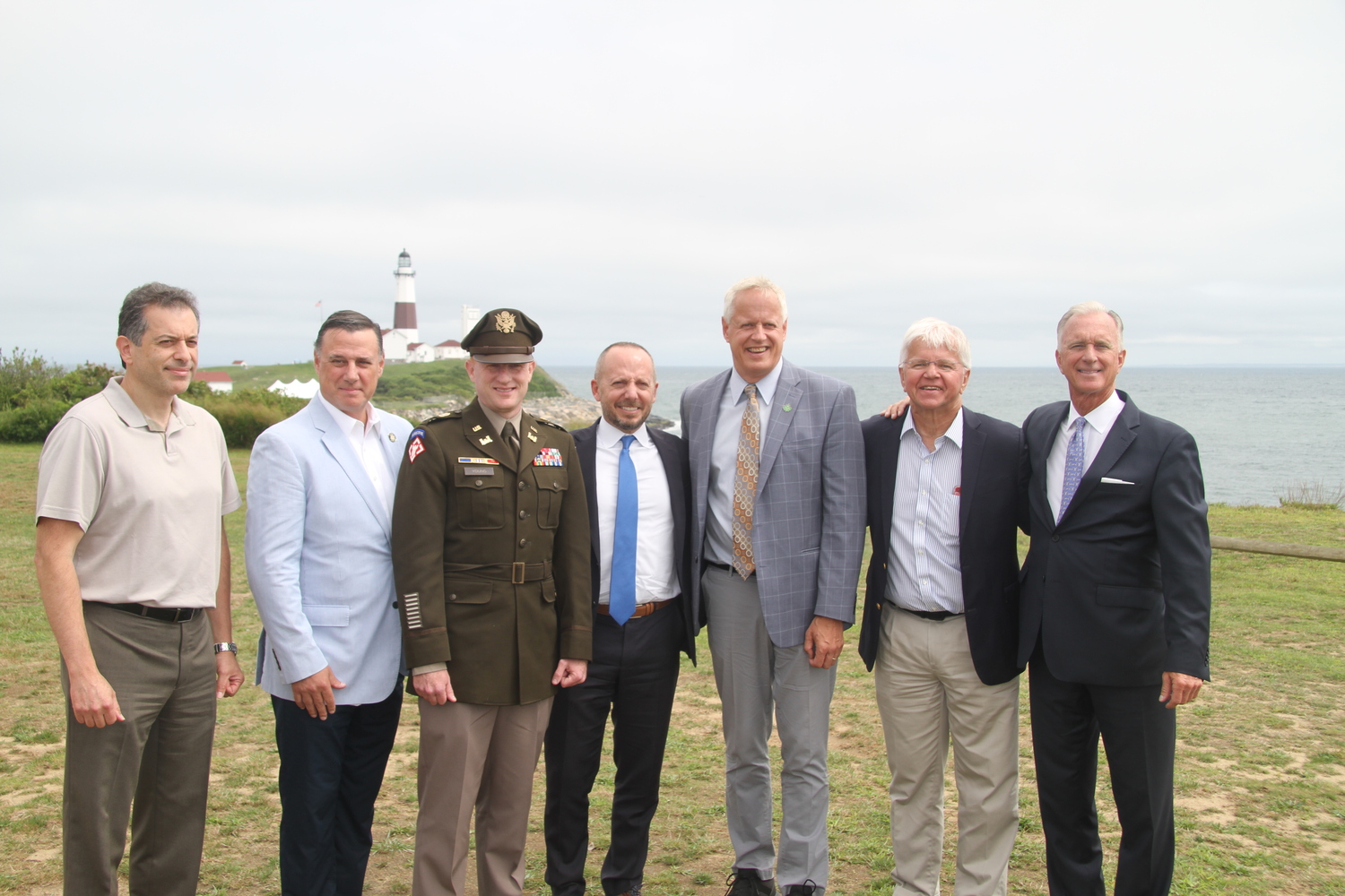 State DEC and Army Corps of Engineers officials with State Senator Anthony Palumbo, second from left, Assemblyman Fred Thiele, second from right, and Montauk Lighthouse Keeper Joe Gaviola, far right. 
MICHAEL WRIGHT