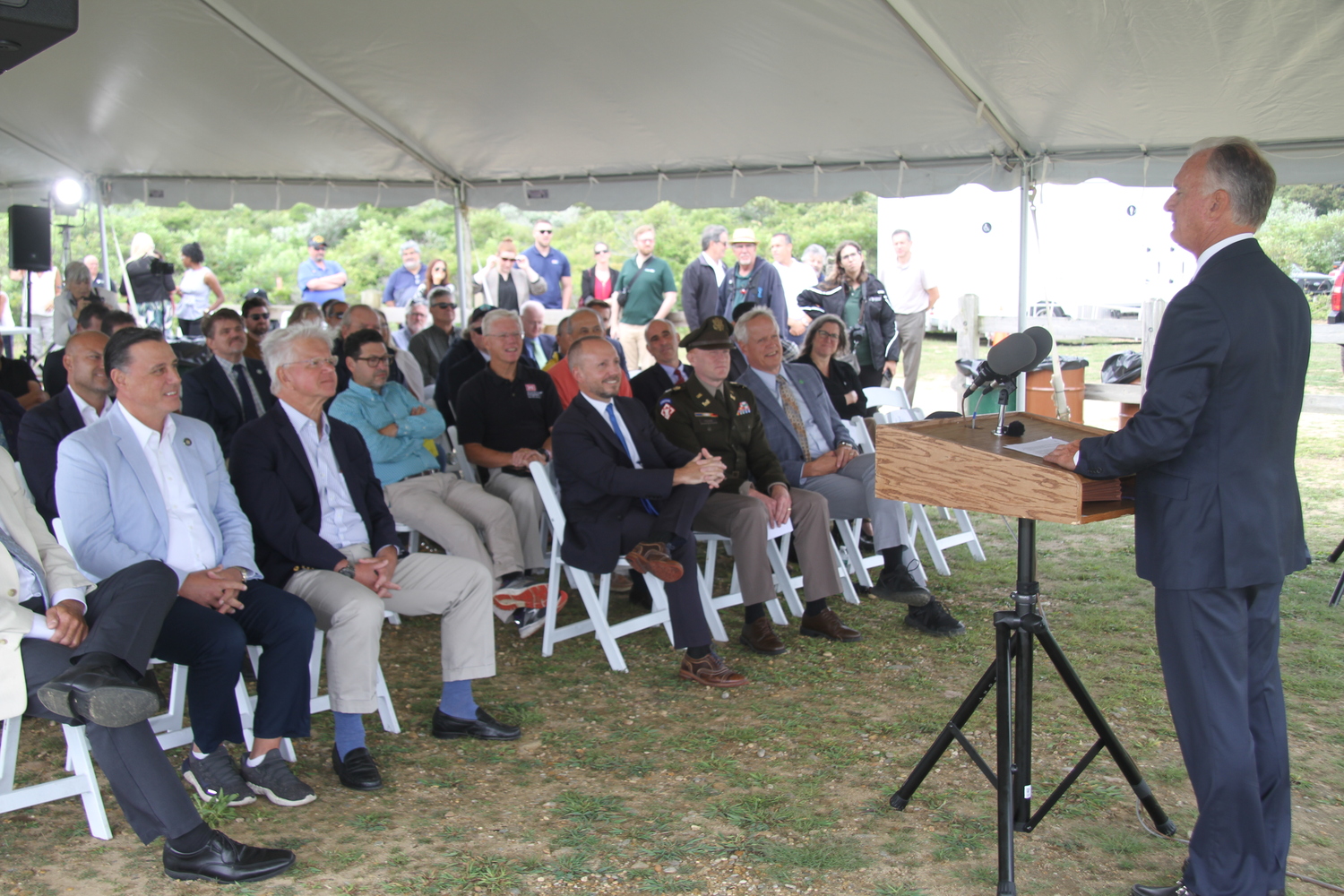 Montauk Lighthouse Keeper Joe Gavioloa speaking to local and state officials at the dedication of the new revetment, built by New York State and the US Army Corps of Engineers, to protect the bluff the lighthouse sits atop. 
MICHAEL WRIGHT