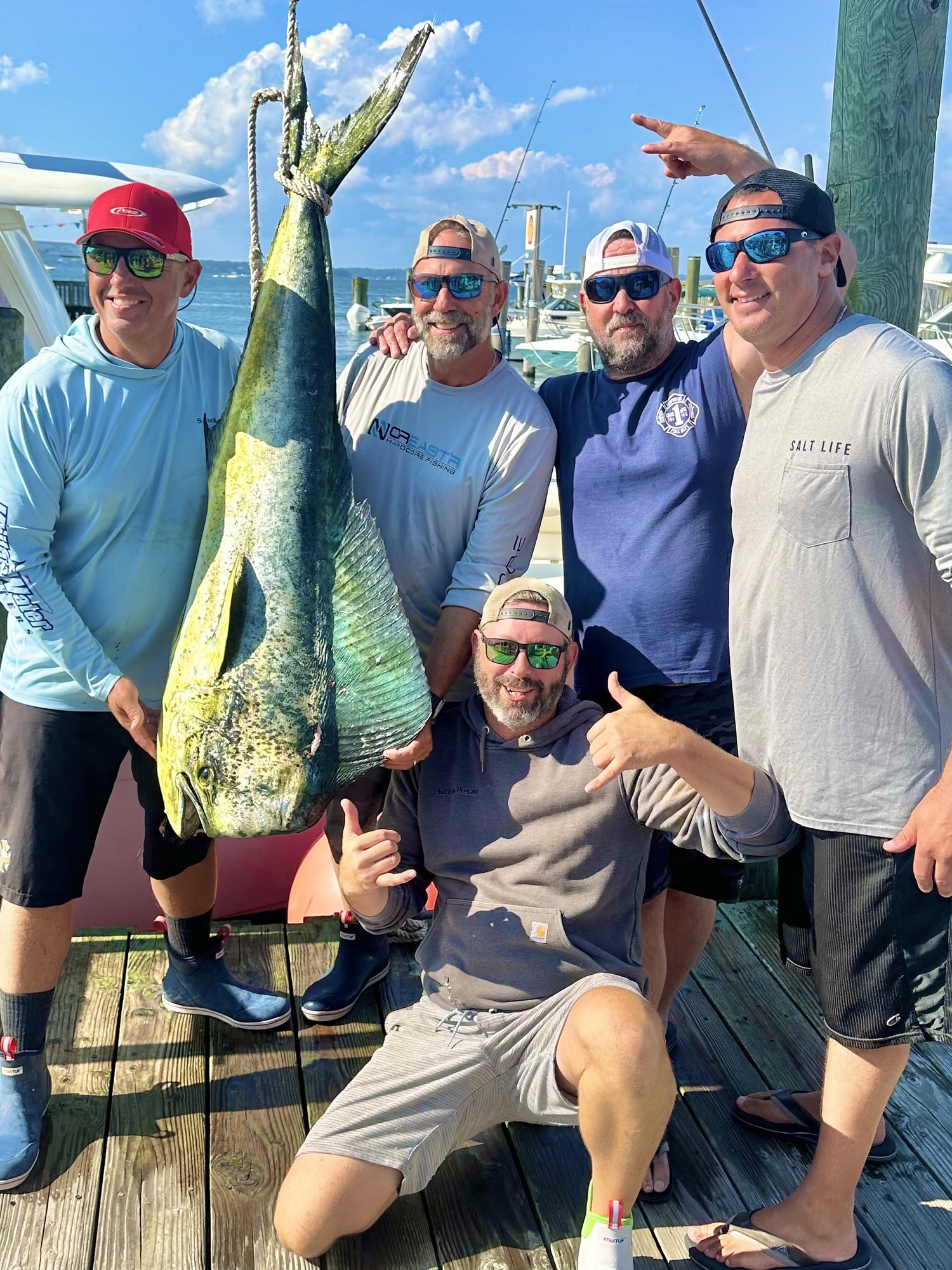 The crew of the Deep Six, Greg Sikorsky, Rick Nydegger, Joe Caputo, Frank Knoll and Shay Lohr with the 51-pound mahi mahi that Nydegger caught while fishing off Hampton Bays.