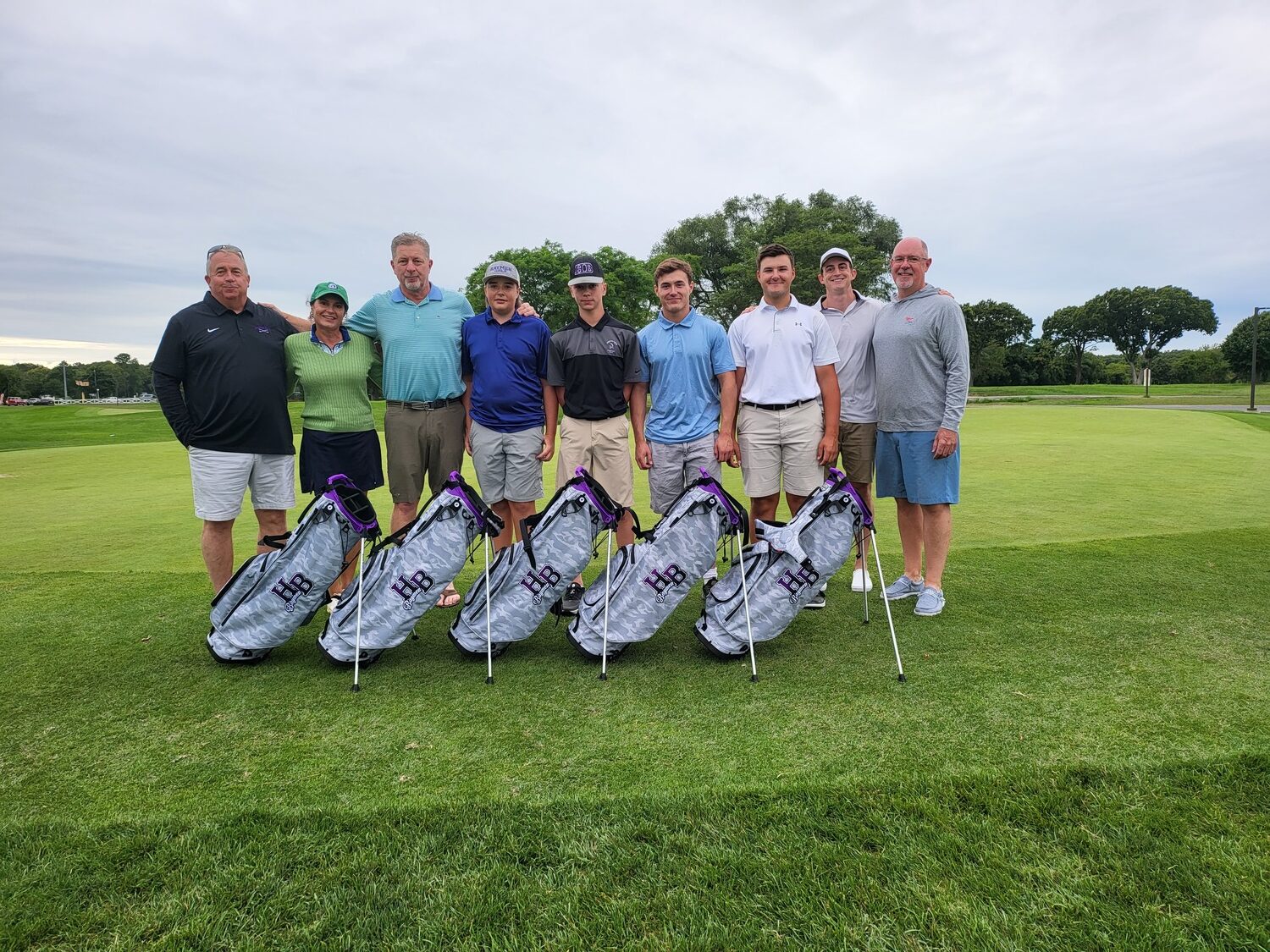 The Hampton Bays golf team was donated new bags  by the Eugene Francolini Golf Initiative through the AJJ Scholarship Fund at Indian Island Golf Course in Riverhead.