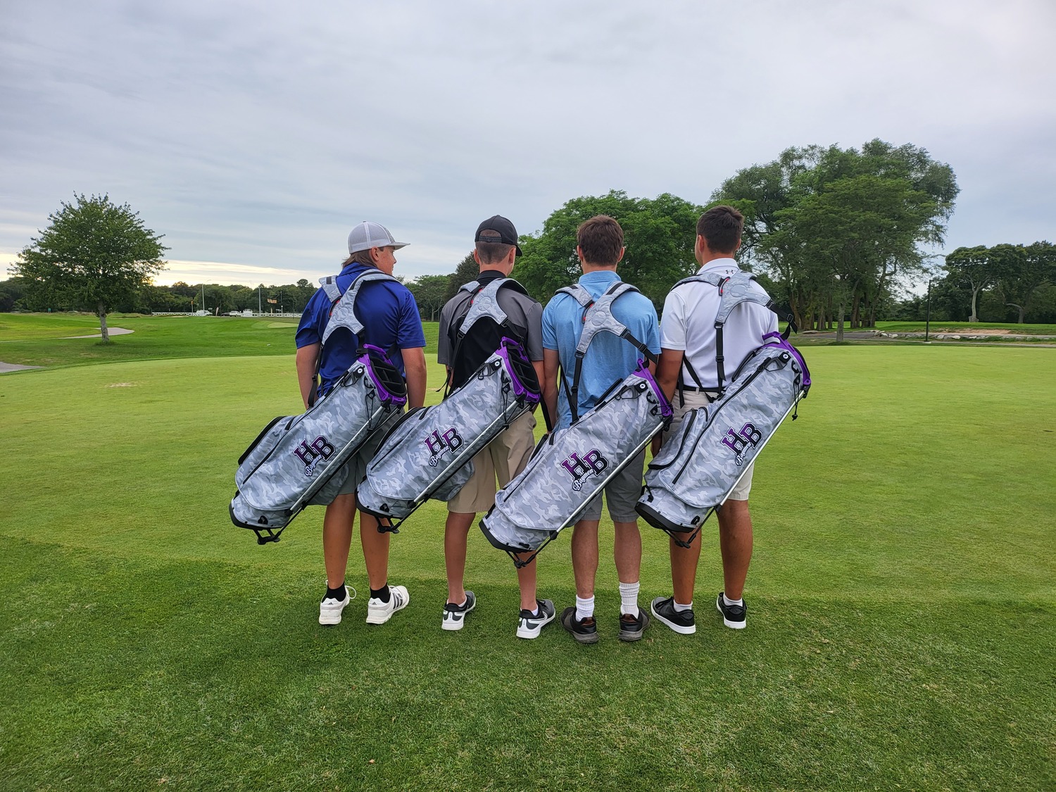 Members of the Hampton Bays golf team show off their new bags donated by the Eugene Francolini Golf Initiative through the AJJ Scholarship Fund.