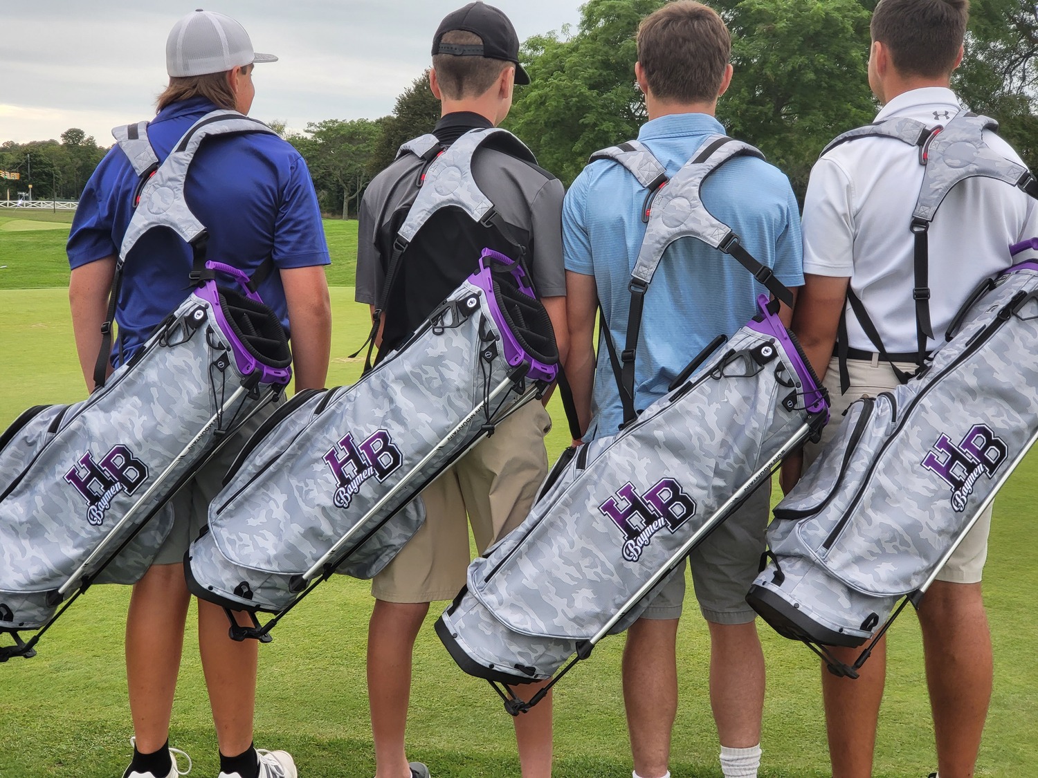 Members of the Hampton Bays golf team show off their new bags donated by the Eugene Francolini Golf Initiative through the AJJ Scholarship Fund.