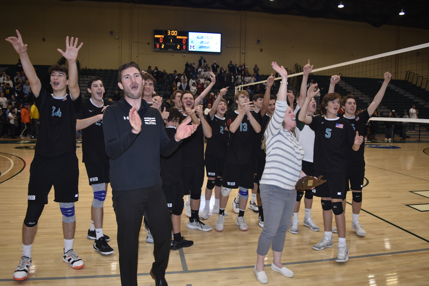 Ben Tuttle, left, and Jackie Reed, are reunited once again as coached on the Westhampton Beach boys volleyball team.   DREW BUDD