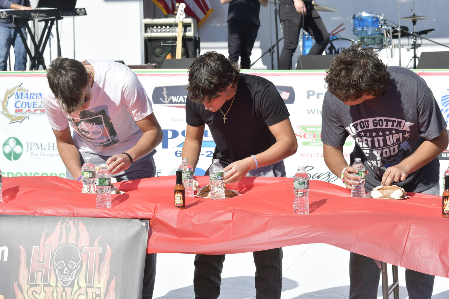 Participants in the cannoli eating contest at the 2022 San Gennaro Festival.  DANA SHAW