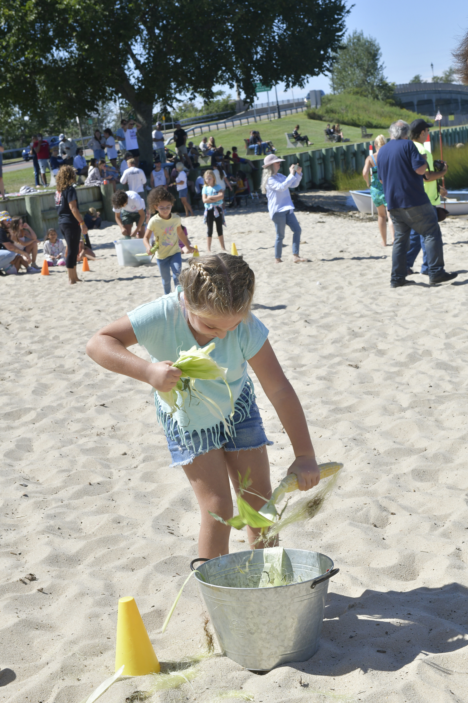 Harper Mallow during the Corn Shucking Contest on Sunday at Windmill Beach.  DANA SHAW