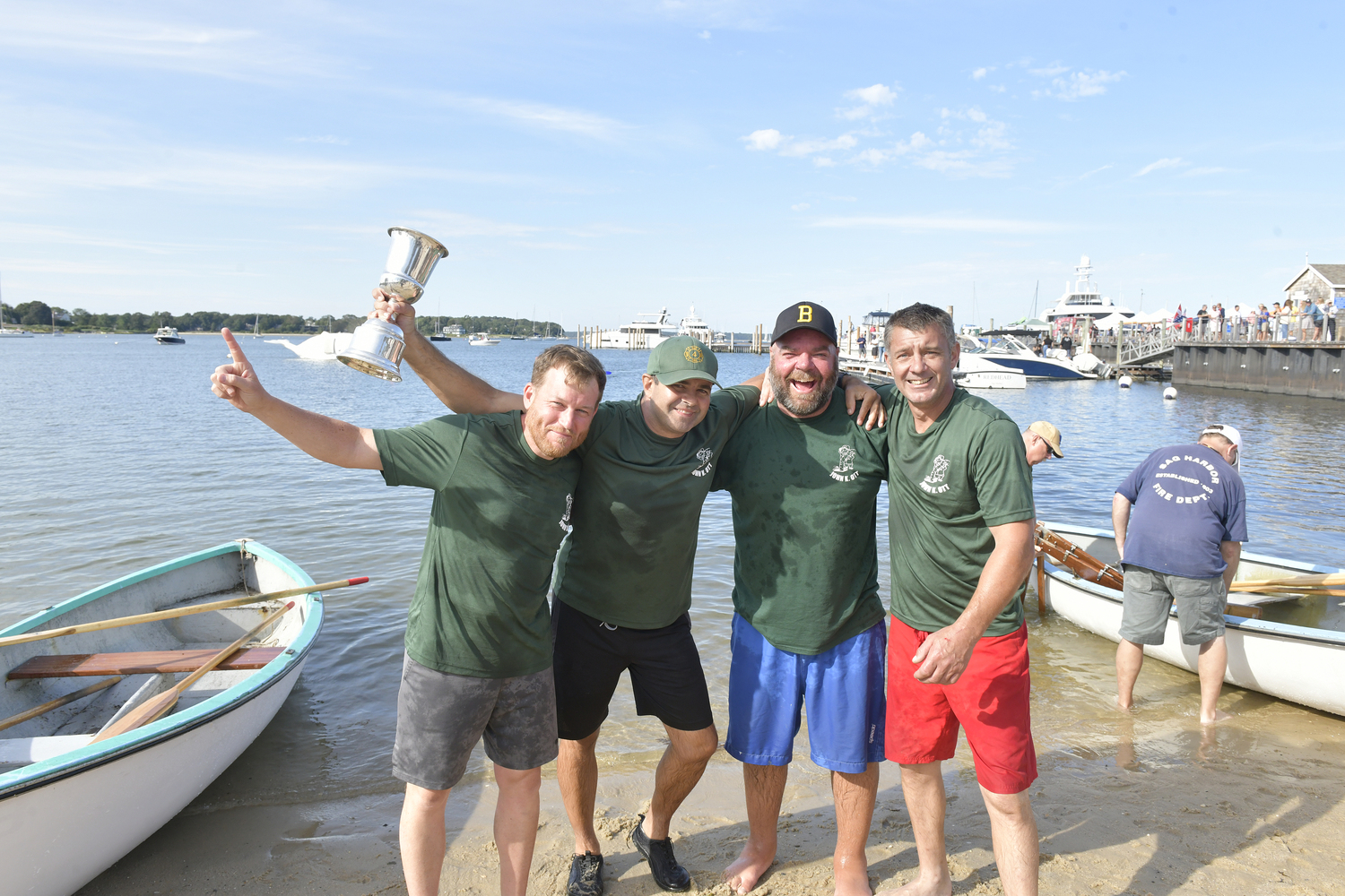 John Cottrell, Gene Garypie, Mike Daniels and Dave Schroeder of the John K. Ott Men's Teams with the Whaleboat Race cup.  DANA SHAW