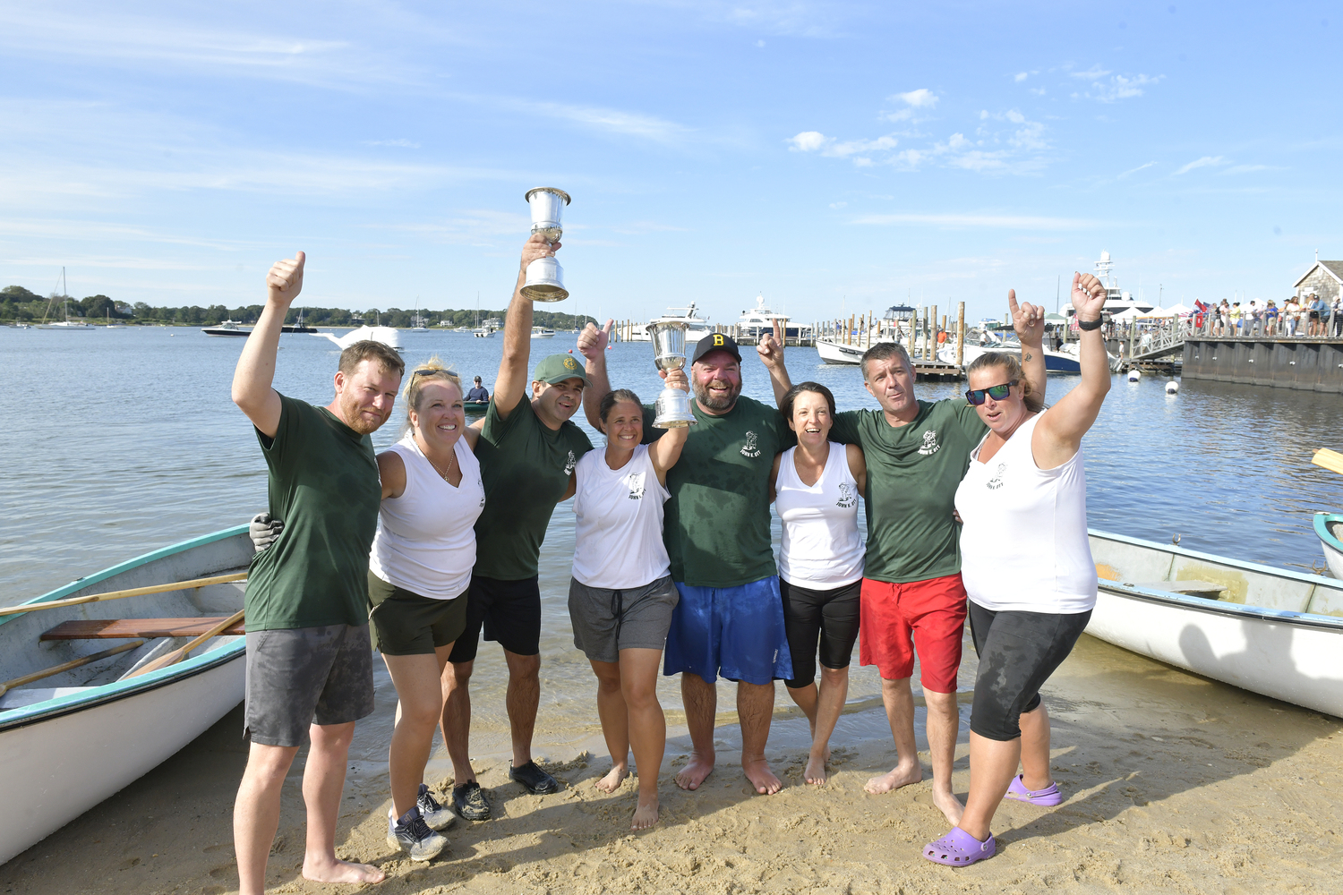 The John K. Ott Men's and Women's Teams swept the Whaleboat Races at HarborFest on Sunday. Left to right are John Cottrell, Shawn Mitchell, Gene Garypie, Shelly Cottrell, Mike Daniels, Karin Schroeder, Dave Schroeder and Robyn Mott.  DANA SHAW