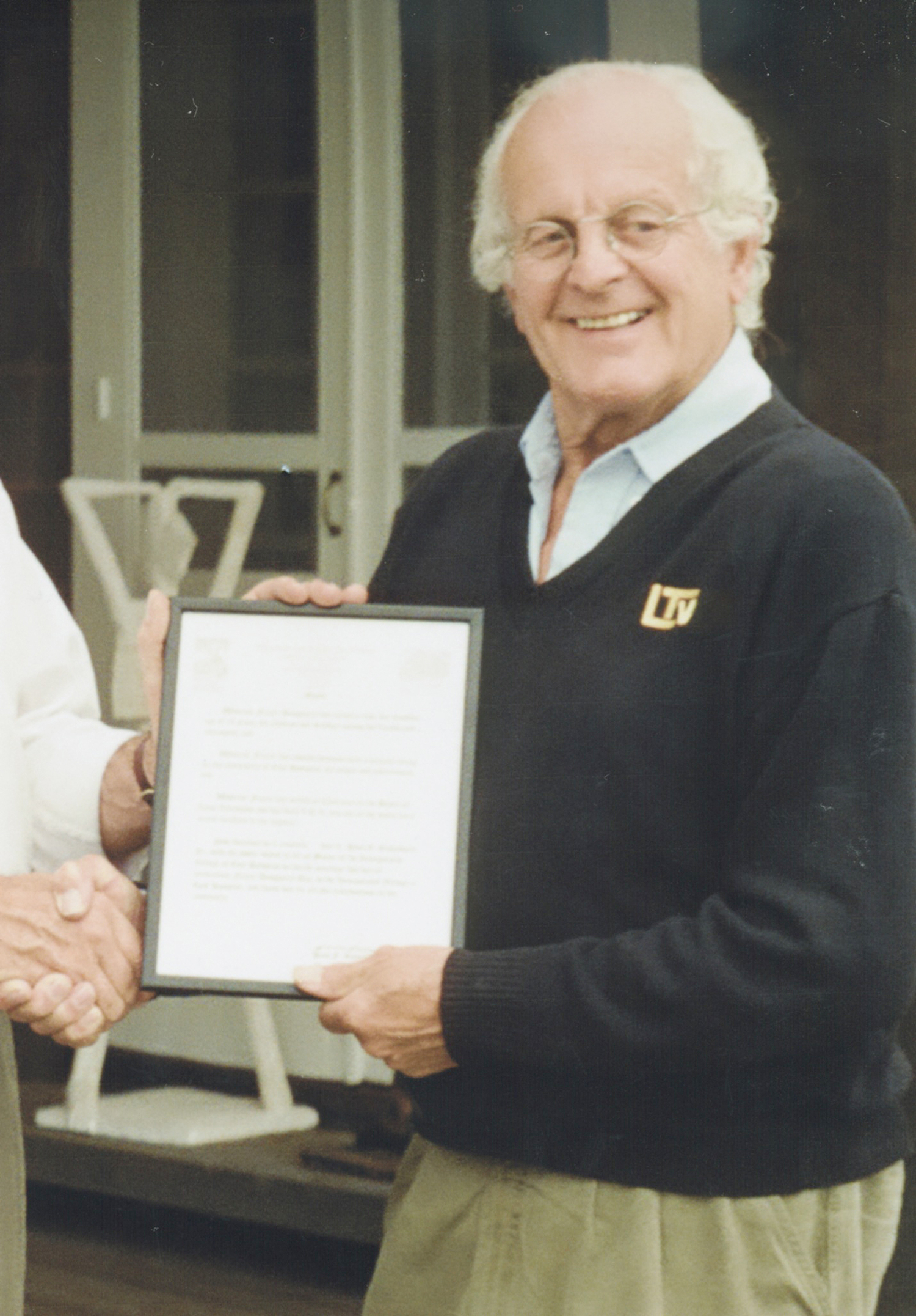 Frazer Dougherty accepts a community leadership award. LTV ARCHIVES