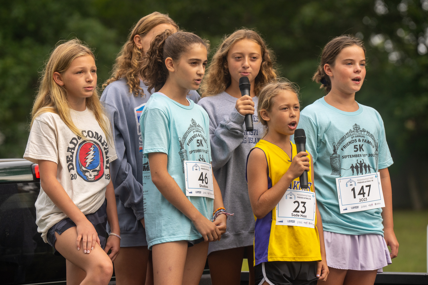 Some of Sag Harbor's youth since the national anthem just prior to Sunday's 5K.   RON ESPOSITO