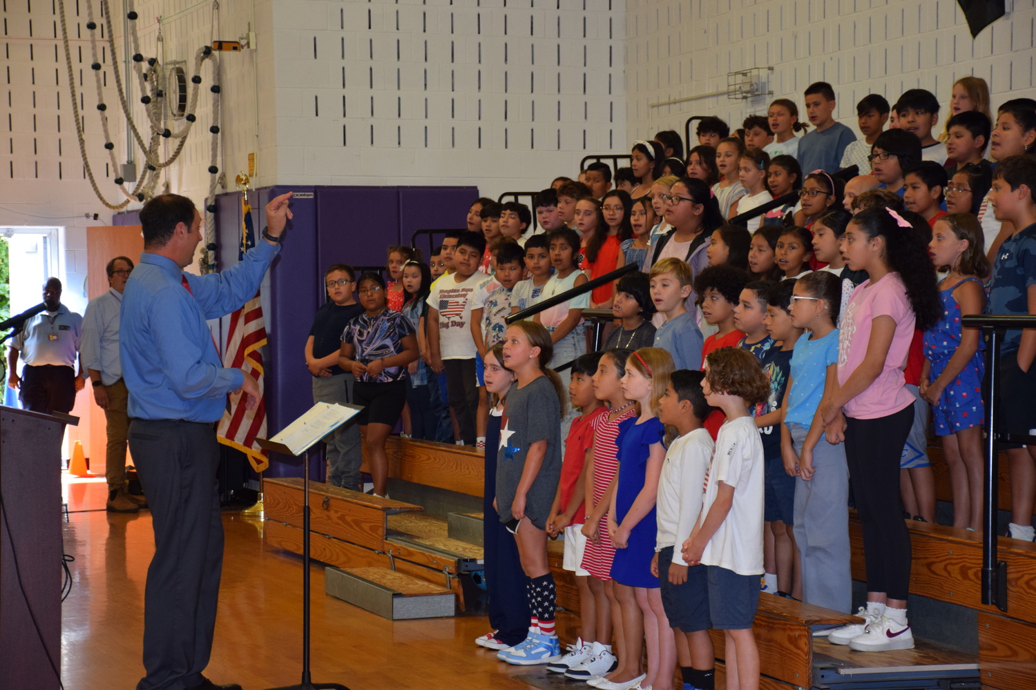 Hampton Bays Elementary School marked the anniversary of 9/11 with a memorial ceremony, during which fourth graders read poems and essays that they wrote about what it means to be a hero and sang patriotic songs, and the Hampton Bays Fire Department presented a memorial wreath. COURTESY HAMPTON BAYS SCHOOL DISTRICT