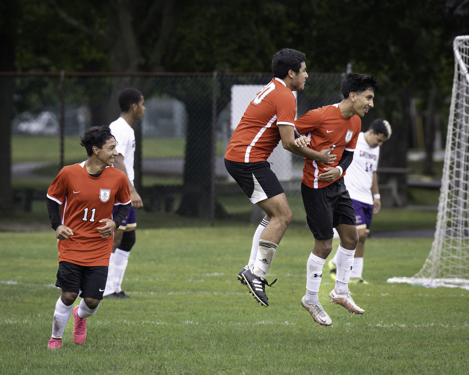 Helio Paucar celebrates with teammates after scoring a goal against Greenport. MARIANNE BARNETT