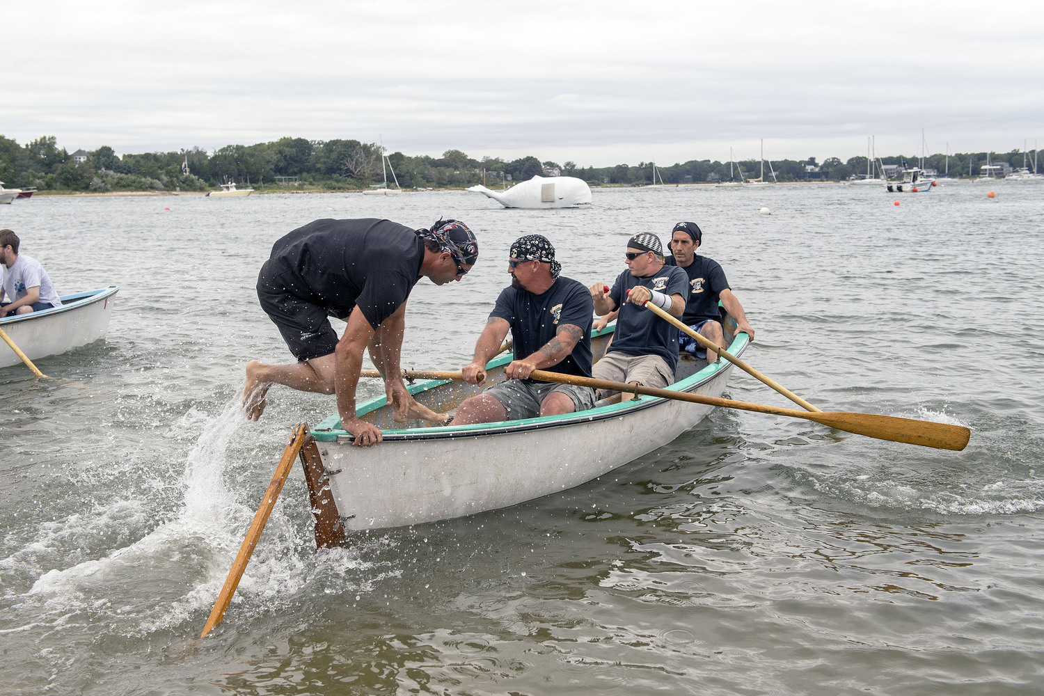 Team Whalers takes to the water at the start of their whaleboat race during the 2018 Harborfest celebration.   MICHAEL HELLER