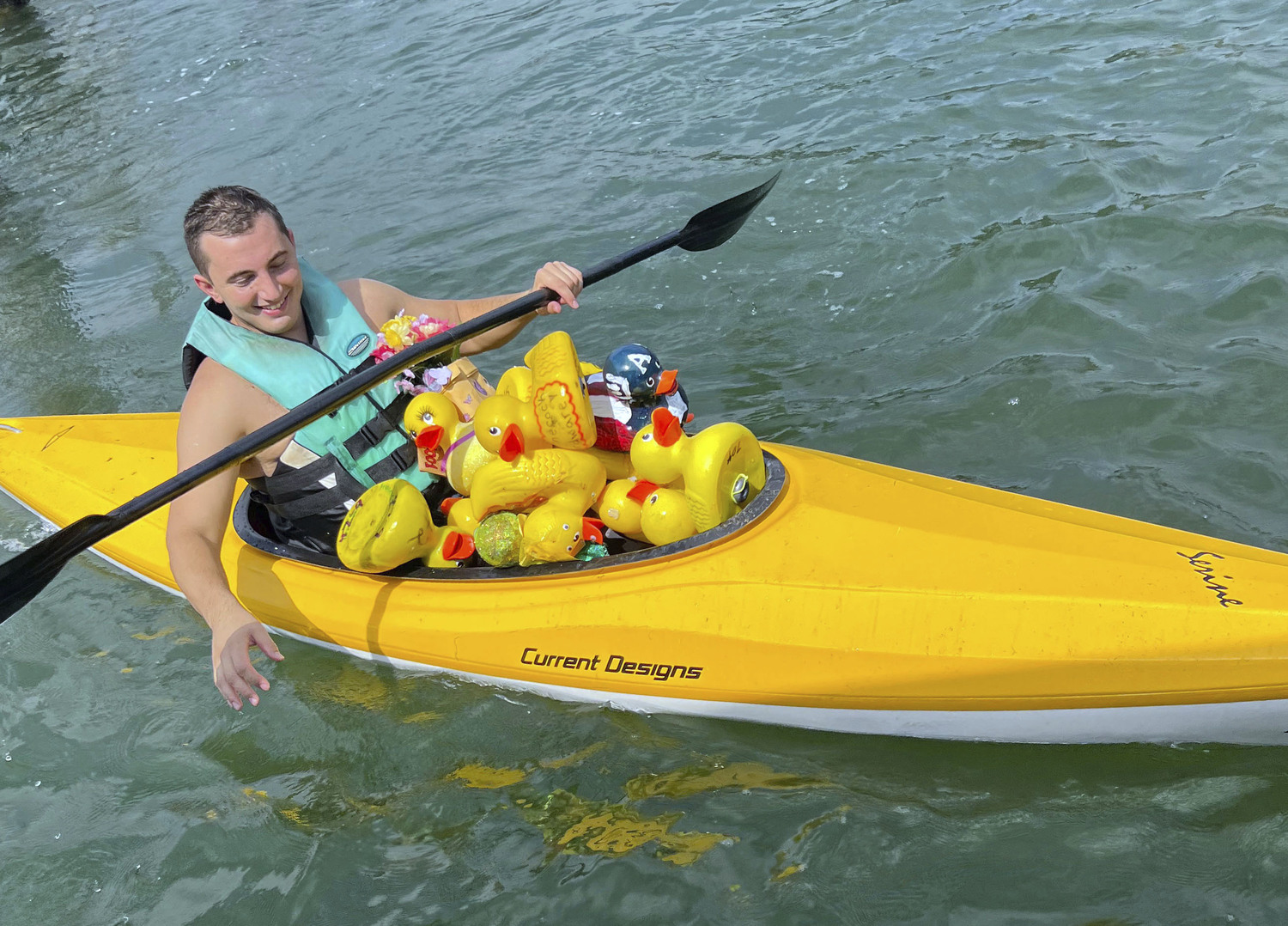 Duck wranglers collect the participants after the race.