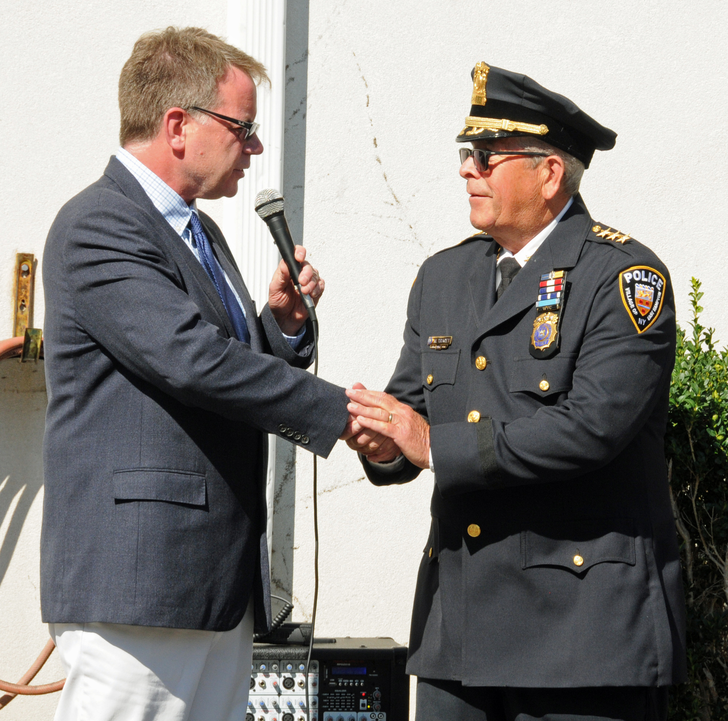 East Hampton Village Police Department Chief Michael Tracey, who stepped down from his post last week after 40 years on the village police force, was honored by Mayor Jerry Larsen and other police officers at a 