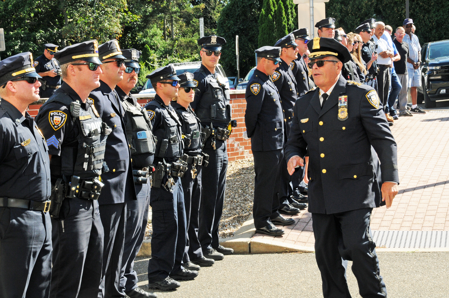 East Hampton Village Police Department Chief Michael Tracey, who stepped down from his post last week after 40 years on the village police force, was honored by Mayor Jerry Larsen and other police officers at a 