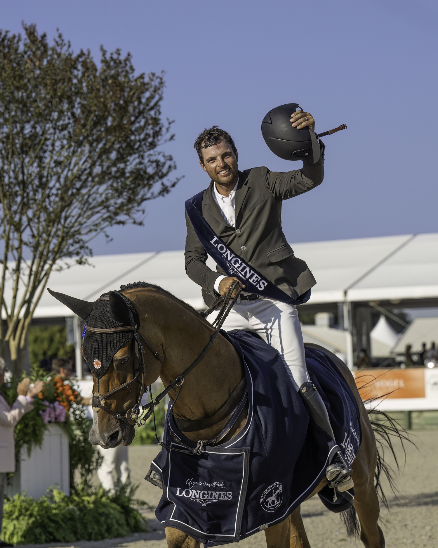 Daniel Bluman and Ladriano Z during the victory gallop. Bluman is hoping to take the 15-year-old gelding to the Olympics next summer, where they will represent Israel. MARIANNE BARNETT