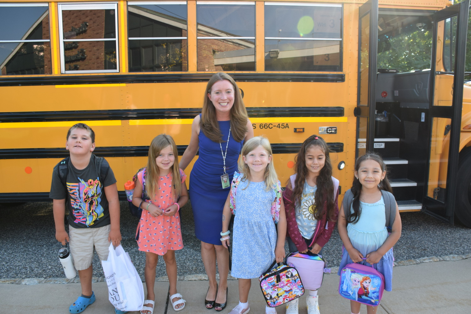 Westhampton Beach School District Superintendent Carolyn Probst greeted students as they arrived back at school on September 6. COURTESY WESTHAMPTON BEACH SCHOOL DISTRICT