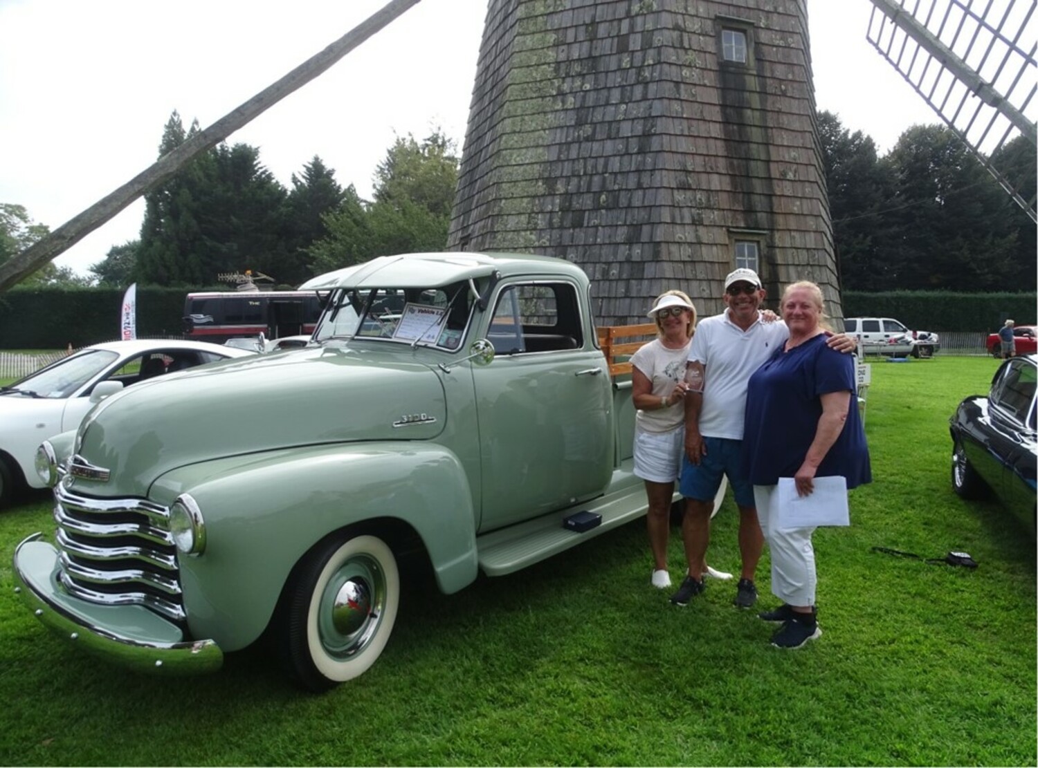 The 22nd annual Water Mill  Car Show on Saturday drew a record number of vehicles, 129, with more than 400 spectators walking through the gates to see them all. Spectators voted for the People's Choice and Jeff Cole and his 1953 Chevy Pick-up 3100 was the top pick. Also placing were  a 1926 Dodge Brothers Depot Hack Woody owned by John Berkoski with the second most votes; and a 1960 Corvette owned by Michael Kowalski. Thea Fry, chair of the event, which raises money for the Water Mill Village Improvement Association, presented the awards. COURTESY CINDY CORWITH