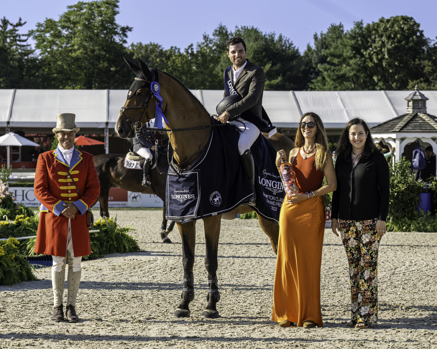 From left, Alan Keeley, Daniel Bluman and Ladriano Z, Joey Wolffer, and Hampton Classic Executive Director Shanette Barth-Cohen during the award presentation after the Grand Prix. MARIANNE BARNETT