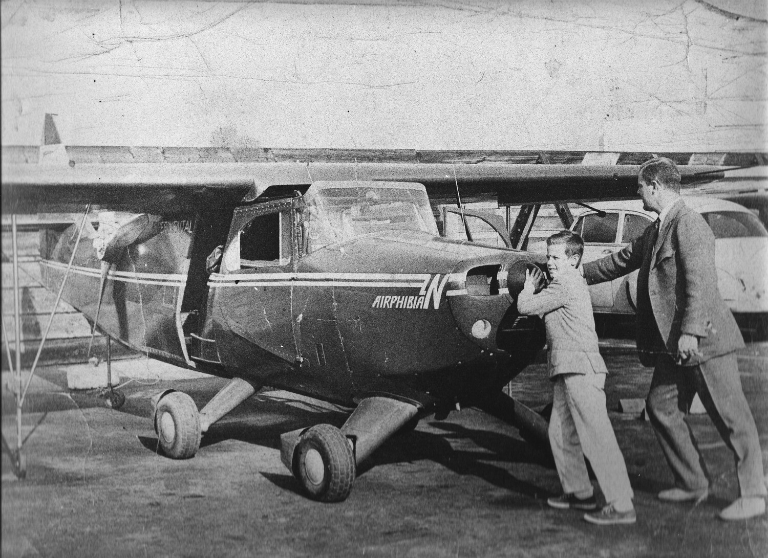 Frazer Dougherty and his son, Rush, reattach the car portion of the Airphibian to its tail and wings in 1953. COURTESY ARIEL DOUGHERTY